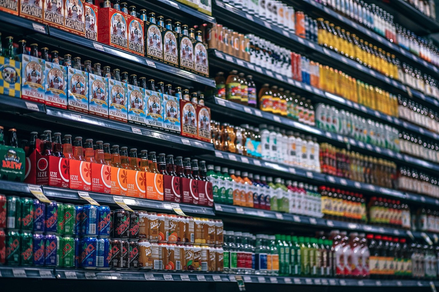 Shelves stacked with a selection of international beers and alcohol