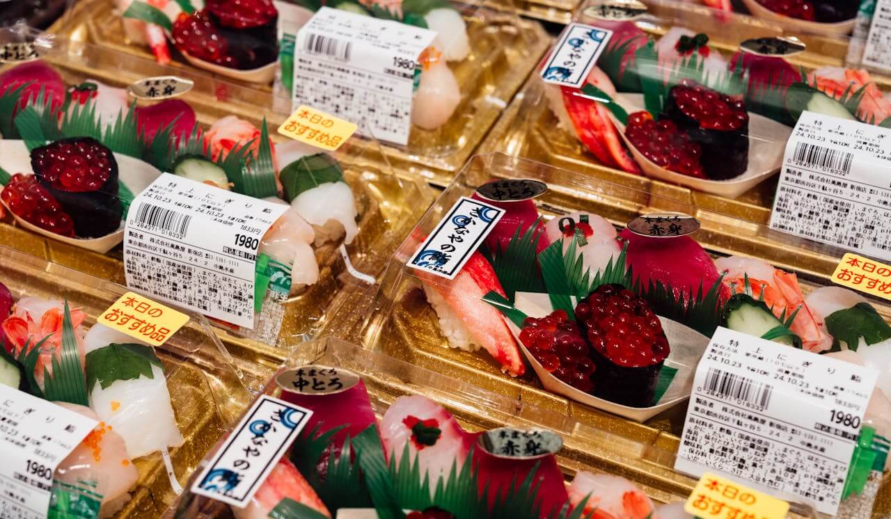 Sushi and sashimi being sold in a supermarket